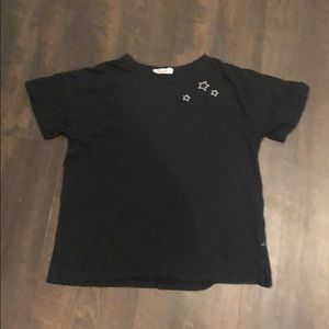 Black Shirt with star detailing.